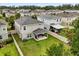 A charming neighborhood featuring well-maintained lawns, fenced yards, and inviting outdoor living spaces at 17416 Painted Leaf Way, Clermont, FL 34714
