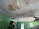 Close up view of water damage on a ceiling in a garage or other room of the home at 1812 Firwood Ct, Orlando, FL 32818