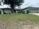 Charming single-story home with mature trees and well-maintained lawn at 1812 Firwood Ct, Orlando, FL 32818