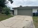 Attached two-car garage with a spacious driveway for easy parking at 1812 Firwood Ct, Orlando, FL 32818