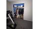Room featuring a closet filled with clothing, shoes, and storage boxes at 1812 Firwood Ct, Orlando, FL 32818