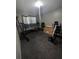 Room featuring a window and various workout equipment, including a stationary bike at 1812 Firwood Ct, Orlando, FL 32818