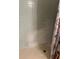 Close up of shower with white tile and some discoloration on the lower part at 1812 Firwood Ct, Orlando, FL 32818