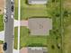Aerial view of roofline, yard, and brick paved driveway at 2168 Aibonito Cir, Clermont, FL 34711
