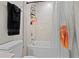 Bathroom featuring a shower and toilet with a decorative sports themed shower curtain at 2168 Aibonito Cir, Clermont, FL 34711