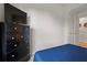 Bedroom features a dresser, tv, and doorway at 2168 Aibonito Cir, Clermont, FL 34711
