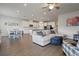Bright, open living space with hardwood floors, modern furniture, and an open-concept design at 2168 Aibonito Cir, Clermont, FL 34711