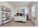 Well-lit home office with a large desk, shelving, and a window provides a comfortable workspace at 2168 Aibonito Cir, Clermont, FL 34711