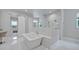 Elegant bathroom with a freestanding tub, marble accents, and modern fixtures at 2459 Mcgregor Oaks Ln, Deland, FL 32720