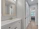 Bathroom featuring a vanity with a modern sink and a view to the hallway at 2459 Mcgregor Oaks Ln, Deland, FL 32720