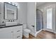 Beautiful bathroom featuring a modern sink, vanity and a glass-enclosed shower at 2459 Mcgregor Oaks Ln, Deland, FL 32720