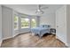 Bright bedroom with large windows, hardwood floors and neutral decor at 2459 Mcgregor Oaks Ln, Deland, FL 32720