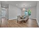 Bright dining room with chandelier lighting, seating for eight, and natural light at 2459 Mcgregor Oaks Ln, Deland, FL 32720