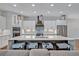 Spacious kitchen with large island, modern stainless appliances, and stylish pendant lighting at 2459 Mcgregor Oaks Ln, Deland, FL 32720