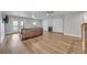 Spacious living room with hardwood floors, ceiling fans, and glass doors to a balcony at 2459 Mcgregor Oaks Ln, Deland, FL 32720