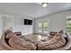 Large living room featuring a huge sectional sofa and double doors to a balcony at 2459 Mcgregor Oaks Ln, Deland, FL 32720