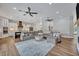 Open-concept living room with contemporary furnishings, recessed lighting, and seamless access to the kitchen at 2459 Mcgregor Oaks Ln, Deland, FL 32720