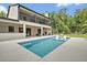 Exterior shot of home with a luxurious pool with built-in lounge chairs at 2459 Mcgregor Oaks Ln, Deland, FL 32720