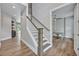 The staircase is centrally located and features a door leading to a private office space at 2459 Mcgregor Oaks Ln, Deland, FL 32720