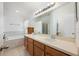 Bright bathroom with a double sink vanity, garden tub, and glass enclosed shower at 2625 Eagle Cliff Dr, Kissimmee, FL 34746