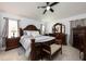 Serene main bedroom featuring a luxurious bed, classic furniture, and soft lighting at 2625 Eagle Cliff Dr, Kissimmee, FL 34746