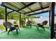 Outdoor patio with artificial grass under a metal awning at 2625 Eagle Cliff Dr, Kissimmee, FL 34746