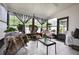 A relaxing sunroom featuring several plants and plenty of natural light at 2625 Eagle Cliff Dr, Kissimmee, FL 34746