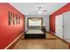 A main bedroom showcasing a ceiling fan, decorative art, and en-suite bathroom at 3000 Laurel Park Ln # 308, Kissimmee, FL 34741