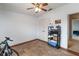 Bedroom with a ceiling fan, tiled floors, and a closet with double doors at 3000 Laurel Park Ln # 308, Kissimmee, FL 34741
