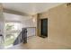 Hallway entrance featuring a staircase, a dark-colored door and an 'EXIT' sign at 3000 Laurel Park Ln # 308, Kissimmee, FL 34741