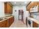 An eat-in kitchen with abundant cabinet space, counter space and white appliances at 3000 Laurel Park Ln # 308, Kissimmee, FL 34741