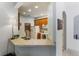 Kitchen and bar featuring appliances and bar stool seating area at 3000 Laurel Park Ln # 308, Kissimmee, FL 34741