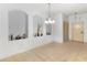 Open concept dining room with ceramic tile flooring and built-in shelving on the walls to display your treasures at 3000 Laurel Park Ln # 308, Kissimmee, FL 34741