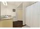 Bathroom includes granite countertop vanity, storage closet, and curtained shower at 3203 Oyster Ln, Kissimmee, FL 34747