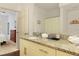 Open view of a bathroom with a granite countertop, a mirror, and a shower at 3203 Oyster Ln, Kissimmee, FL 34747