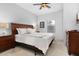 Bright bedroom featuring queen bed, wood dresser, and lots of natural light at 3203 Oyster Ln, Kissimmee, FL 34747