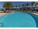 Inviting community pool with ample seating and lush landscaping at 3203 Oyster Ln, Kissimmee, FL 34747