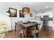 Elegant dining area with stylish lighting, hardwood floors, and view to the kitchen at 3203 Oyster Ln, Kissimmee, FL 34747
