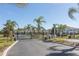 Gated community entrance with lush landscaping providing security and a welcoming ambiance at 3203 Oyster Ln, Kissimmee, FL 34747