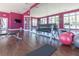 Bright gym with plenty of natural light, weights, equipment, and mirrors for your fitness needs at 3203 Oyster Ln, Kissimmee, FL 34747