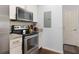 Stainless steel stove, oven, microwave and white cabinets in this kitchen at 3203 Oyster Ln, Kissimmee, FL 34747