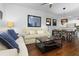 Open-concept living room and dining area with hardwood floors and stylish decor at 3203 Oyster Ln, Kissimmee, FL 34747