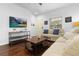 Bright living room with hardwood floors, comfortable seating, and modern decor at 3203 Oyster Ln, Kissimmee, FL 34747
