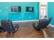 Fun-filled playroom equipped with TVs, comfortable chairs, and a view of the inviting outdoors at 3203 Oyster Ln, Kissimmee, FL 34747