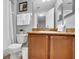 Granite vanity top and bright mirror makes getting ready easy in this bathroom at 3214 Calabria Avenue, Davenport, FL 33897