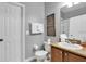 Cozy bathroom with framed art, tile floors, and granite vanity top at 3214 Calabria Avenue, Davenport, FL 33897