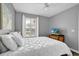 Comfortable bedroom with bright window and light walls at 3214 Calabria Avenue, Davenport, FL 33897