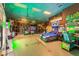 Fun and colorful game room with a variety of arcade games, slides, and attractions at 3214 Calabria Avenue, Davenport, FL 33897