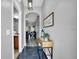 Inviting foyer with wood-look floors and stylish console table at 3214 Calabria Avenue, Davenport, FL 33897