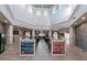 Spacious interior featuring high ceilings, stone accents, and directory signs to various shops and amenities at 3214 Calabria Avenue, Davenport, FL 33897